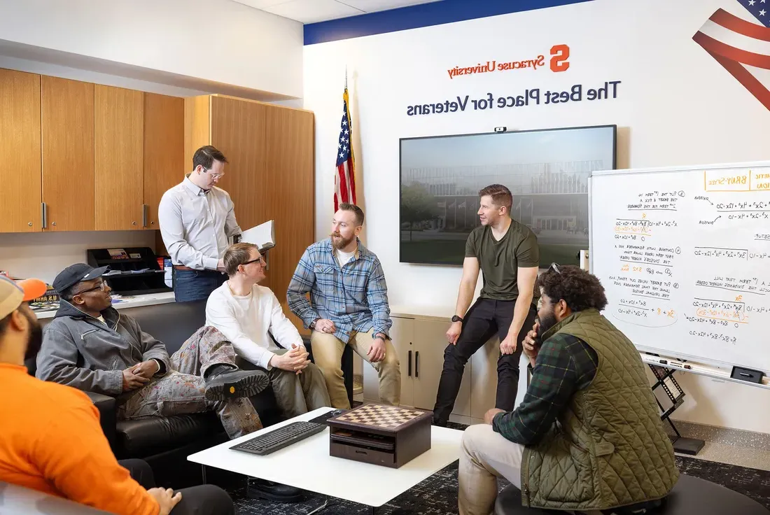 Portrait of Raphael Grollmus with a group of other student veterans.